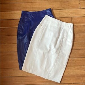 Calling all Video Vixens! 2 genuine leather skirts circa 1980’s. White & Purple